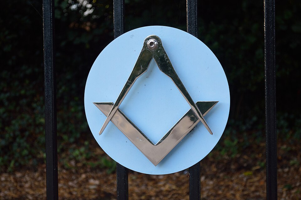 The Square and Compasses sign on the gates of Freemasons' Hall, Knole Road, Boscombe, Bournemouth, BH1 4DH.