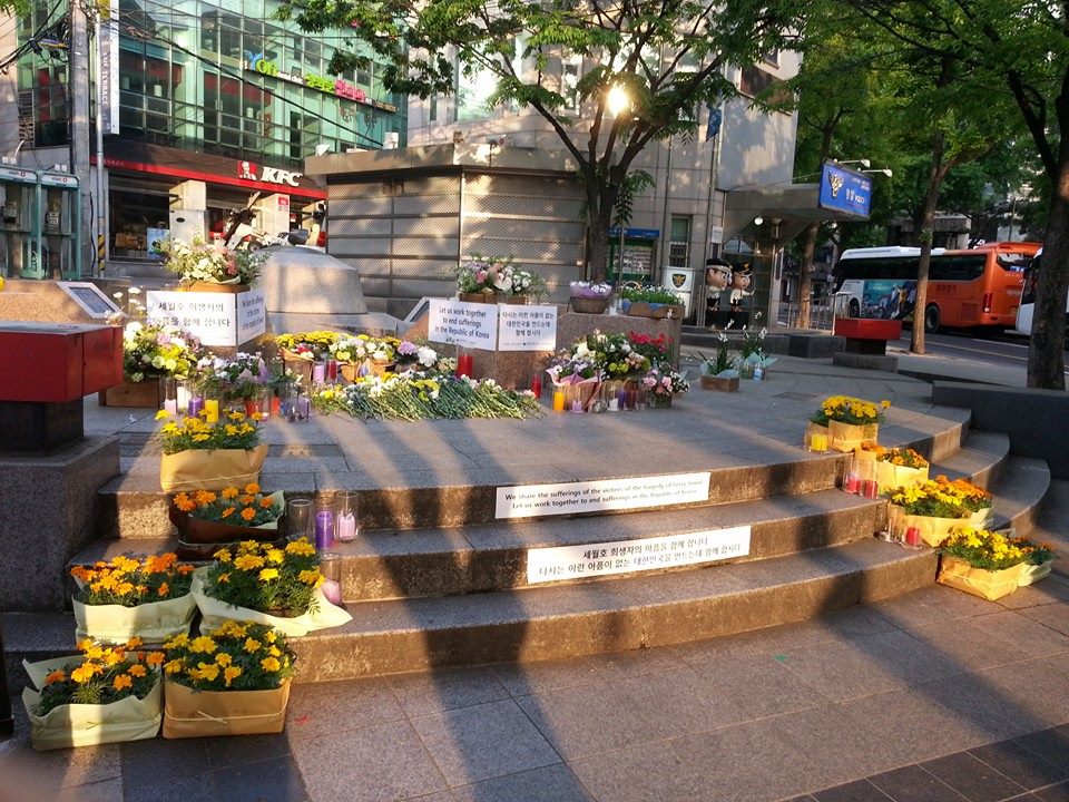 Flowers and candles for Sewol victims near Seoul City Hall, 1 May 2014